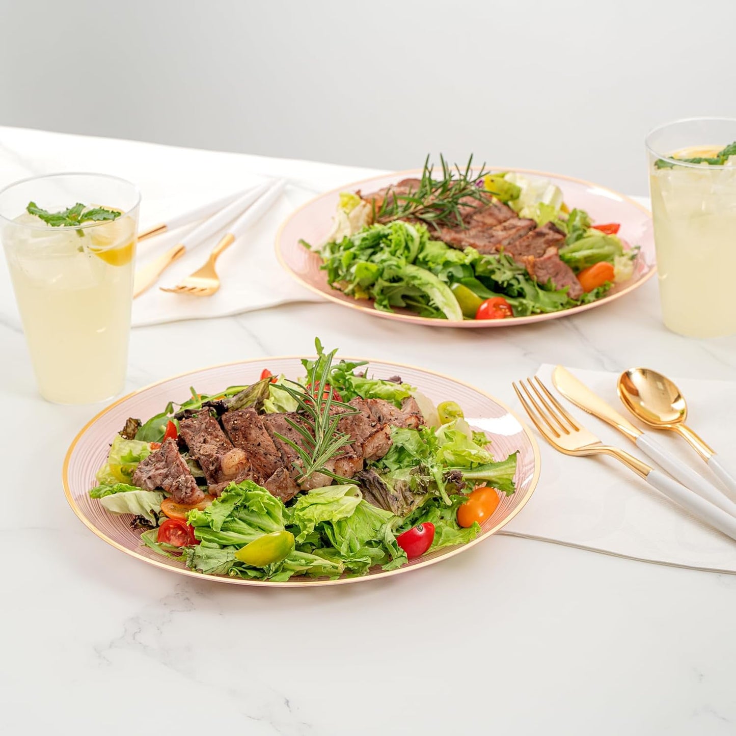 Restaurantware Plastic Plates 100 Pcs 10" Gold Rimmed Disposable Plates Heavy-Duty Pink Translucent Rippled Plastic Dinner Servers for Party, Weddings, Salads, Desserts, and Appetizers